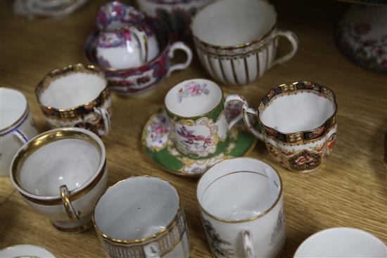 A collection of 19th century floral painted teaware and a French gilt decorated two handled vase